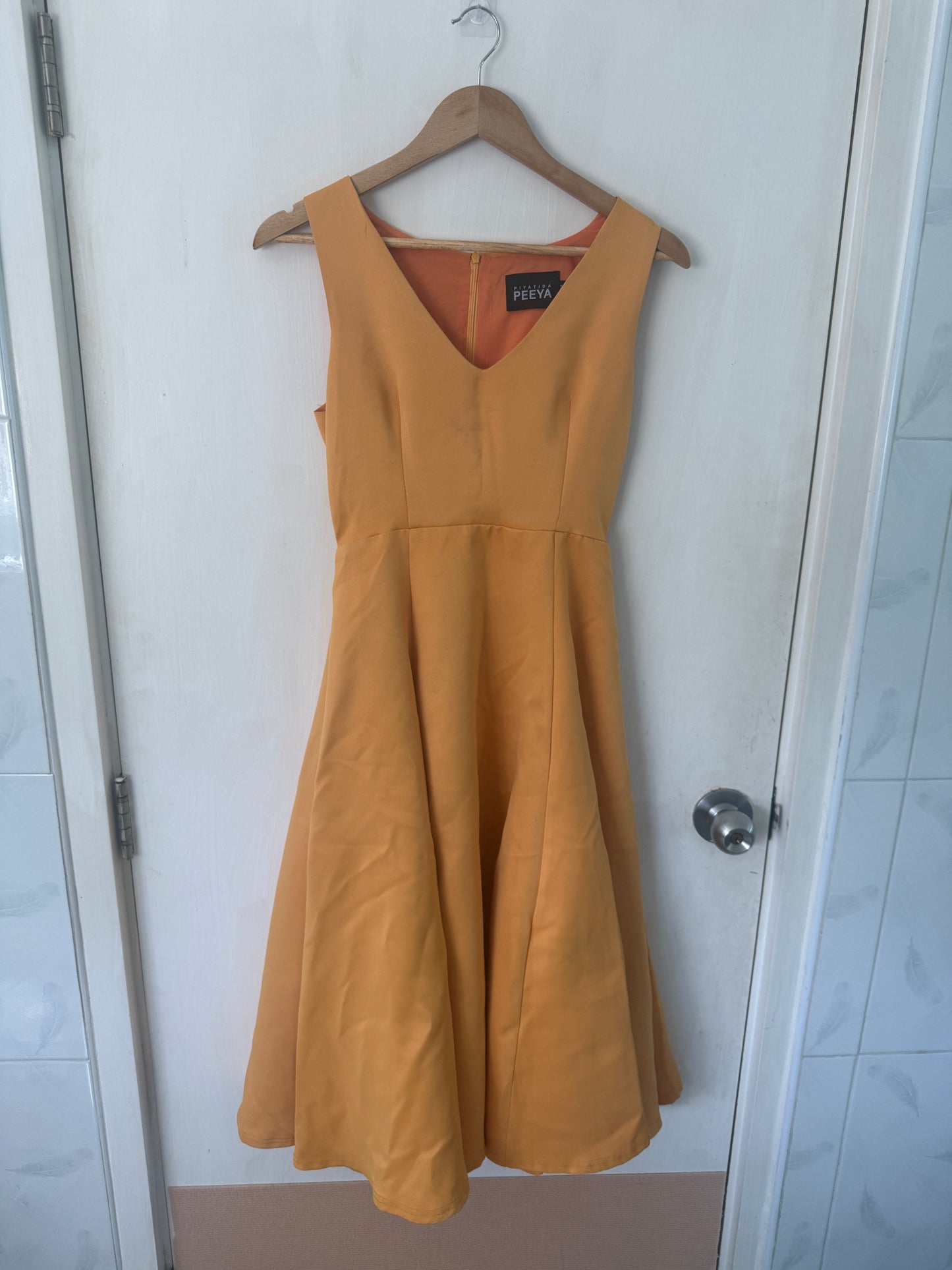 Orange Fit-and-Flare V-Neck Midi Dress — Warm Caramel Tone — Piyatida Peeya