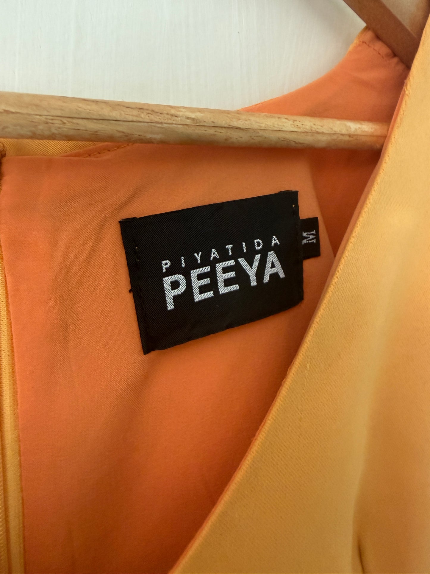 Orange Fit-and-Flare V-Neck Midi Dress — Warm Caramel Tone — Piyatida Peeya