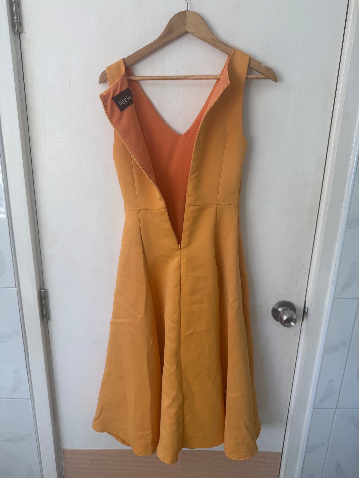 Orange Fit-and-Flare V-Neck Midi Dress — Warm Caramel Tone — Piyatida Peeya